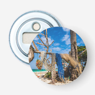 Abrebotellas Redes de pesca que se secan en la playa