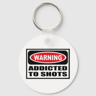 ADICTO amonestador al llavero de los TIROS