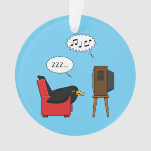 Adorno Blackbird durmiendo frente al cómic de la TV