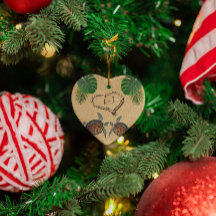 Corazón de arena y palmas de tortugas marinas pers