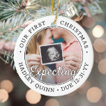 Adorno De Cerámica 2 Fotografía 1er Navidad Esperando bebé nuevos pad<br><div class="desc">Celebre el precioso regalo de su nuevo miembro de la familia con un elegante adorno de cerámica redonda de dos fotos. El diseño neutro de género es adecuado para un niño o chica de recién nacido. El texto y las imágenes de esta plantilla son fáciles de personalizar y pueden ser...</div>