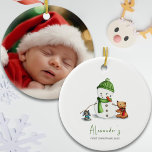 Adorno De Cerámica Bebé primera foto de Snowman de Navidad<br><div class="desc">Adorable primer ornamento de bebé navideño con un ilustracion exclusivo de un lindo muñeco de nieve y algunos amigos animales de un lado. En el otro lado puedes añadir la foto de tu bebé. Gran manera de celebrar y valorar la primera Navidad de tu bebé y un gran placer para...</div>