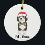 Adorno De Cerámica Bernedoodle Santa Hat y Bowtie<br><div class="desc">¡Estoy enamorado de este ilustracion de acuarela muy detallado de un bernedoodle o sheepadoodle gris, negro y blanco en un adorno con una corbata de arco roja y verde dulce y un combo de sombrero santa! Personalice estos ornamentos y haga una lista agradable este año! Para los regalos perfectos, emparejételos...</div>