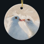 Adorno De Cerámica Besando palomas - Amor<br><div class="desc">Imagen de dos palomas blancas de besos contra el fondo beige elegante. Texto blanco Amor. Completo,  romántico,  elegante y único adorno de personalizable. Puede cambiar o eliminar el texto.</div>