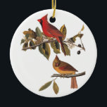 Adorno De Cerámica Bookplate de Audubon del vintage de los pájaros<br><div class="desc">Este par de pájaros del pájaro cardinal se encarama en un árbol de almendra salvaje. El pájaro masculino es un rojo brillante y y la hembra es un color de oro con las marcas rojas. Éste es el bookplate 159 de los pájaros de John James Audubon de América. El ornamento...</div>