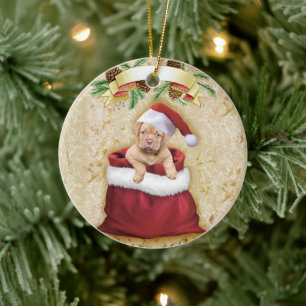 Adorno De Cerámica Cachorro en una bolsa con juguetes para Navidades