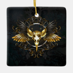 Adorno De Cerámica Calavera de pájaro dorado sobre fondo negro