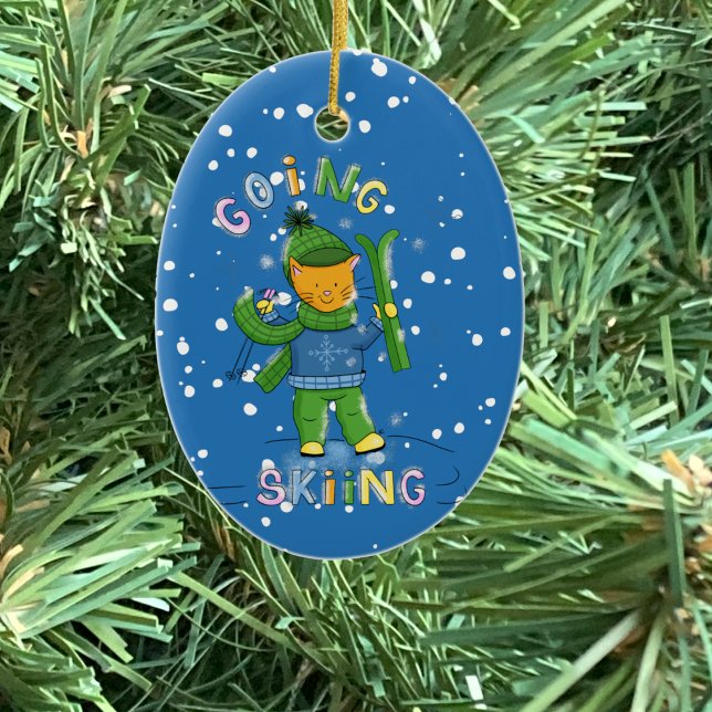 Adorno De Cerámica Cat going skiing Christmas ornament (Cat going skiing blue oval ceramic Christmas ornament .)