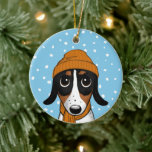 Adorno De Cerámica Cerámica para vacaciones de perros de invierno de<br><div class="desc">Piebald Dachshund Con Naranja Beanie Gorra y bufanda. Este adorable adorno navideño de perro hace un dulce regalo y el tesoro agudo de ser para mostrar en el árbol por los años venideros. Personalice con su propio texto. Visita el mundo doodle de Jenn para más regalos de vacaciones con este...</div>