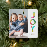 Adorno De Cerámica Colorida foto de Navidades de JOY Festividad<br><div class="desc">Añade un toque de color a tu árbol de Navidad con este divertido y brillante adorno fotográfico de vacaciones, con una colorida tipografía que dice, "JOY". La palabra JOY está diseñada con una apariencia de papel tisular superpuesta en colores llamativos de verde, cal, rosa, rojo, azul acuático y amarillo dorado....</div>