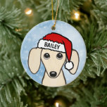 Adorno De Cerámica Cream Dachshund Santa Wiener Dog Nombre personaliz<br><div class="desc">Un adorable adorable adorno navideño de Cream Dachshund en inglés que puede ser personalizado con tu propio texto. Añade un nombre para un regalo de personalizado divertido. Hace un adorable ornamento para exhibirlo en el árbol de Navidad en los años por venir. Visite el mundo doodle de Jenn para ver...</div>