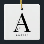 Adorno De Cerámica Cuadrado de nombres celestes monogramo<br><div class="desc">Añada un toque de magia celeste a su decoración navideña con este impresionante adorno navideño monograma. Con una carta adornada con pequeñas estrellas y lunas a su alrededor y su elección de nombre debajo, este adorno personalizado es el recuerdo perfecto para la temporada. Se puede ajustar cómodamente hasta 10 caracteres...</div>