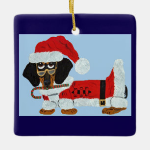 Adorno De Cerámica Dachshund negro y marrón de Santa con un bastón de