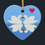 Adorno De Cerámica Dos cisnes en el corazón clásico de San Valentín<br><div class="desc">Este encantador corazón de cerámica del Día de San Valentín presenta mi sencillo diseño de dos cisnes,  con sus picos toques,  en la clásica pose del corazón,  y su reflejo. Un regalo insólito para alguien especial e ideal para el equipo con la tarjeta coincidente.</div>