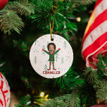 Adorno De Cerámica Duelo gracioso de Navidades de la cara y el nombre<br><div class="desc">¡Trae risas y alegría a tu temporada de fiestas con este adorable adorno navideño personalizado, con un adorable elfo con la cara personalizado de tu hijo, miembro de tu familia, amigo o incluso mascota! Perfectamente diseñado para captar el espíritu de las fiestas, este capricho caprichoso convierte a un ser querido...</div>