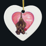 Adorno De Cerámica El día de San Valentín de perro de Hound<br><div class="desc">Desfile Animal Romántico Hound Dog Heart and Love regalos, tarjetas y accesorios traídos a usted por Imagine That! El diseño presenta nuestra divertida obra de arte de un perro de hebilla marrón que sostiene en la boca a un rosa bonito con los corazones púrpura, rojo y rosado estratificados digitalmente por...</div>