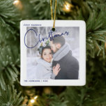 Adorno De Cerámica Foto manuscrita de los primeros Navidades casados<br><div class="desc">Recuerde a sus primeros Navidades casados para siempre con este moderno y minimalista adorno vacacional, que incluye a los 'Navidades en la moderna y moderna tipografía con letras a mano azul y su foto boda favorita. La foto se repite en la parte posterior, con los detalles de la fecha de...</div>