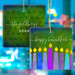 Adorno De Cerámica Hanukkah Menorah Candle Script Name Green Keepsake<br><div class="desc">“Happy Hanukkah.” A playful, modern, artsy illustration of boho pattern candles helps you usher in the holiday of Hanukkah in style. Assorted blue candles with colorful faux foil patterns overlay a rich, deep green textured background. On the back, personalize with your family name and year, over a tiny dark green...</div>