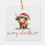 Adorno De Cerámica Highland Cow Santa Script nombre Feliz Navidad<br><div class="desc">Highland Cow Santa Script nombre Feliz Navidad. Agradable decoración para Navidades,  con un diseño divertido con una dulce vaca de la montaña en su sombrero de Santa. Feliz Navidad está en un guión elegante.</div>