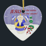 Adorno De Cerámica Jesús es la razón de nuestra temporada Ornament<br><div class="desc">¡Un placer para mantener el foco de la temporada en la que pertenece! El arte utilizado para crear este maravilloso y a la vez significativo adorno navideño fue creado a partir de pinturas de color acuático a mano de Audrey Jeanne Roberts. Este adorno tiene un adorador muñeco de nieve, un...</div>