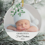 Adorno De Cerámica La primera foto de Mistletoe de Navidad del bebé<br><div class="desc">Este adorable Ornamento de Navidad del Bebé es decorado con mistletoe acuarela. Personalizable fácil con la foto, nombre y año de su bebé. Utilice la Herramienta de diseño para cambiar el tamaño, estilo o color del texto. Porque creamos nuestra obra de arte no encontrarás esta imagen exacta de otros diseñadores....</div>