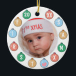 Adorno De Cerámica La primera foto navideña de un bebé rico<br><div class="desc">El primer ornamento navideño de tu bebé personalizado con una foto rodeada de baudias de colores pastel y un año al frente con el nombre al revés.</div>