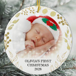 Adorno De Cerámica La primera foto navideña del bebé<br><div class="desc">Este elegante ornamento navideño está decorado con follaje dorado sobre un fondo blanco. Fácilmente personalizable con el nombre,  año y foto del bebé. Las estrellas blancas pequeñas no están incluidas en el diseño. Acuarela original © Michele Davies.</div>
