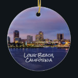 Adorno De Cerámica Long beach California, Skyline at Dusk,<br><div class="desc">Línea aérea de Long Beach,  California al atardecer en la parte delantera de este adorno de dos lados. Una imagen detallada y gráfica del volante en el barco de la Reina María en la parte trasera. Cambie la fecha del año al año que elija.</div>