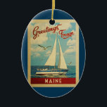 Adorno De Cerámica Maine Sailboat Vintage Travel<br><div class="desc">Este diseño náutico vintage de Greetings From Maine incluye un barco que navega en el agua con gaviotas y un cielo azul lleno de hermosas nubes blancas.</div>
