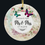 Adorno De Cerámica Mariposas en Shabby Vintage Collage Mr. y Mrs.<br><div class="desc">Un adorno boda diseñado con mariposas en magenta rosa y verde esmeralda. Un marco circular blanco con los detalles de su boda sobre un collage vintage poco atractivo con rosas rosas rosas rosas y otros elementos decorativos. El Sr. y la Sra. escribieron con un sofisticado tipo de letra de escritura...</div>
