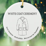 Adorno De Cerámica Médica Médico Ceremonia de Abrigo Blanco Monograma<br><div class="desc">Ceremonia Monogramada del Médico médica White Coat para celebrar y honrar a un médico o médica en entrenamiento. Conservación de la memoria elegante para honrar a alguien un rito de paso donde se recita el juramento hipocrático en su profesión médica. Cuenta con un abrigo, nombre, fecha y campo de trabajo...</div>