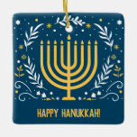 Adorno De Cerámica Menorah Hanukkah decorativo<br><div class="desc">Asegúrate de incluir Hanukkah mientras celebras a los Navidades o añadirla a tu decoración de Chanukah. Este adorno decorativo de Hanukkah tiene una menorah dorada rodeada de hojas, estrellas y remolinos sobre un rico fondo azul. Añade tu propio mensaje al revés o suéltelo para dejarlo en blanco. Ideal para una...</div>