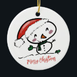 Adorno De Cerámica Muñeco de nieve lindo con sombrero de Santa<br><div class="desc">Adorno de cerámica de muñeco de nieve lindo con sombrero de Santa Lleva mucha más alegría navideña a tu árbol con un adorno de cerámica personalizado. Agrega fotos familiares, imágenes y mensajes personales a ambos lados de este adorno. Un hilo de oro hace que sea fácil colgar este fantástico recuerdo....</div>
