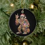 Adorno De Cerámica Navidades de Santa Bigfoot iluminan la diversión d<br><div class="desc">Navidades de Santa Bigfoot iluminan rock Funny Sasquatch Belige</div>