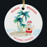 Adorno De Cerámica Navidades de Surfing Tropical en Santa Beach<br><div class="desc">Santa se está tomando unas vacaciones muy necesarias y está viviendo una buena vida, surfeando y relajándose en una playa de isla tropical. Tiene los dedos de los pies en la arena, una bebida en la mano, palmeras y una cálida brisa oceánica. El saludo "Warm Wishes" está en un color...</div>