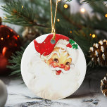 Adorno De Cerámica Navidades de Vintage Jolly Santa Claus<br><div class="desc">Este Jolly Santa le dará a sus Navidades un ambiente festivo. Oranment festeja a un Papá Noel de color rosa en su gorra rojo y un brote de mistletoe.</div>