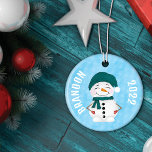 Adorno De Cerámica Navidades Gorras de Cute Snowman Scarf<br><div class="desc">Este lindo y lúdico patrón de ilustracion es perfecto para la temporada de vacaciones de los Navidades. Presenta nevados de acuarela pintados a mano en diferentes escenarios. El del frente es un muñeco de nieve acurrucado con suavidad en su cálido equipo de invierno. El patrón en la parte de atrás...</div>