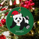 Adorno De Cerámica Navidades Monogramas Cute Panda Bear Kids<br><div class="desc">Este adorno navideño del oso panda de bonito Santa Claus es un hermoso regalo para las fiestas de animales para un niño que ama los osos panda. ¡Me gustan los animales salvajes y un oso panda Navidad se lleva el pastel con un sombrero rojo de Santa! Personaliza este regalo verde...</div>