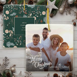 Adorno De Cerámica Navidades Secuestran a Navidades de fotografía de<br><div class="desc">Este sencillo ornamento fotográfico navideño presenta "Feliz Navidad" en un elegante y moderno guión y un texto personalizado para su apellido. El fondo ofrece un boho patrón de verdor de invierno que aparece en suaves tanques y carnes sobre un fondo verde verde azulado oscuro y ofrece texto extra para los...</div>