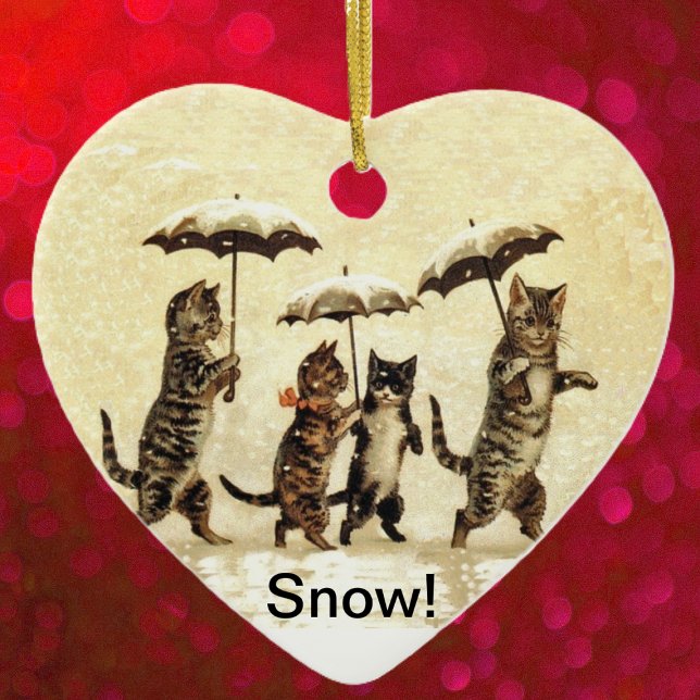 Adorno De Cerámica Nieve de paraguas salvajes gatos (Four brown cats walking upright umbrellas in falling snow on yellow heart shaped ceramic ornament.)