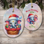 Adorno De Cerámica Niños elefantes de cesta de regalo<br><div class="desc">Aquí hay un adorable adorno de Navidad para un nieto, nieta, hijo o hija especial. Por un lado está la imagen de un lindo elefante con un gorra de Santa Claus rojo y blanco. El pequeño elefante sale de una cesta de regalos de mimbre entre regalos envueltos de colores vivos....</div>