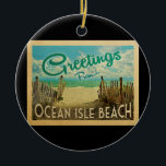 Adorno De Cerámica Ocean Isle Beach Ornament Vintage Travel<br><div class="desc">El diseño de esta postal antigua de Greetings From Ocean Isle Beach presenta una playa de arena con un hermoso agua turquesa del océano y sobre el mar,  un cielo azul con nubes blancas onduladas. En estilo de viajes vintage.</div>