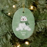 Adorno De Cerámica Oso Polar Con Navidades De Carne Verde<br><div class="desc">Este pequeño oso polar dulce acuarela está adornado con una bufanda verde y listo para celebrar las fiestas. Usa este ornamento personalizado para conmemorar la temporada.</div>