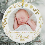 Adorno De Cerámica Our First Christmas As Parents Gold Foliage Photo<br><div class="desc">This elegant Parents' Christmas Ornament is decorated with gold foliage on a white background.
Easily customizable with baby's photo and year.
Original Watercolor © Michele Davies.</div>