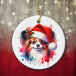 Adorno De Cerámica Perro Papillon en Santa Hat Navidades personalizad<br><div class="desc">Perro de cachorro Papillon personalizado adorno navideño. Si tienes un Papillon,  este cuadro de acuarela dulce es perfecto.</div>
