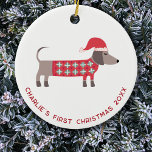 Adorno De Cerámica Primer perro Dachshund de Navidad personalizado<br><div class="desc">El dulce y adorable Dachshund Sausage o el perro Wiener en un suéter de punto festivo y el sombrero de Santa Navidad rojo. Cambie el nombre,  la fecha y el texto para personalizar. Arte original de Nic Squirrell.</div>