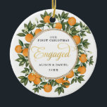 Adorno De Cerámica Primera Navidad Boda involucrado Citrus Greenery<br><div class="desc">Este adorno navideño inspirado en los cítricos presenta hermosos naranjas pintados a mano y una exuberante vegetación. ¡Genial para un boda de verano! Los campos de texto son completamente editables excepto para la palabra "Engaged" (Involucrado). Simplemente elimine esta palabra haciendo clic en el botón borrar y agregue su propio texto...</div>