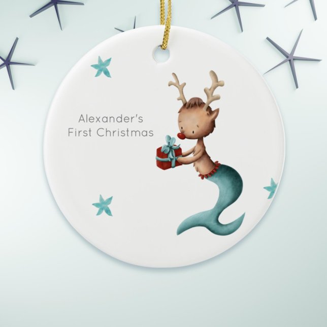 Adorno De Cerámica Primerísima Navidad de la sirena de renos (Cute first Christmas ornament with a mermaid reindeer holding a present. )