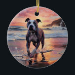 Adorno De Cerámica Sandy American Staffordshire Dog on Beach Sunset<br><div class="desc">Sumérjase en la tranquila belleza de nuestro perro "Sandy Paws and Sunset Hues" en el diseño de la puesta de sol en la playa. Esta escena cautivadora capta la esencia de una velada perfecta en la orilla, con un compañero fiel canino disfrutando de la arena dorada y los tonos impresionantes...</div>