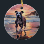 Adorno De Cerámica Sandy American Staffordshire Dog on Beach Sunset<br><div class="desc">Sumérjase en la tranquila belleza de nuestro perro "Sandy Paws and Sunset Hues" en el diseño de la puesta de sol en la playa. Esta escena cautivadora capta la esencia de una velada perfecta en la orilla, con un compañero fiel canino disfrutando de la arena dorada y los tonos impresionantes...</div>